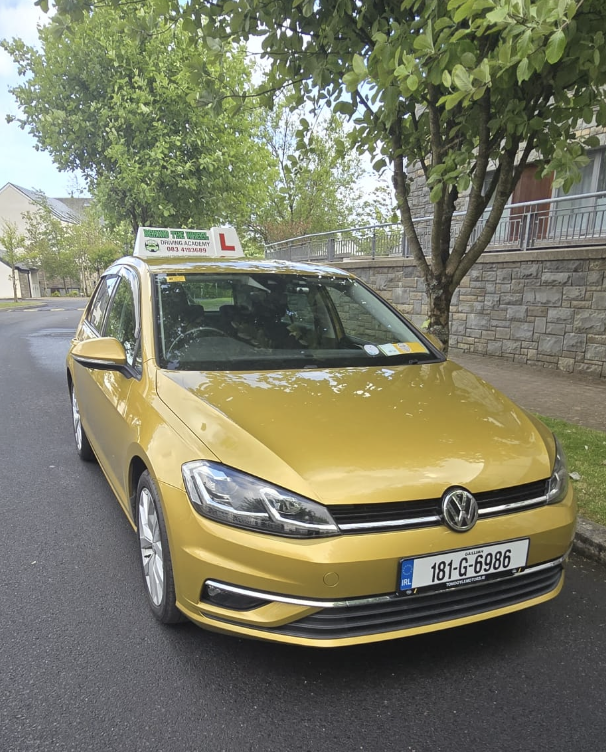 BTW Driving School automatic learner car on a leafy suburban road